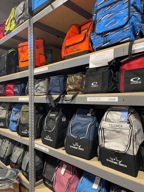 Shelves of disc golf bags for sale
