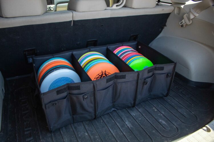Disc tote holding a variety of different disc golf plastics.