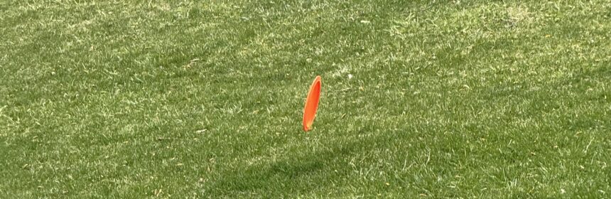 Disc rolling down the fairway. Roller shot.