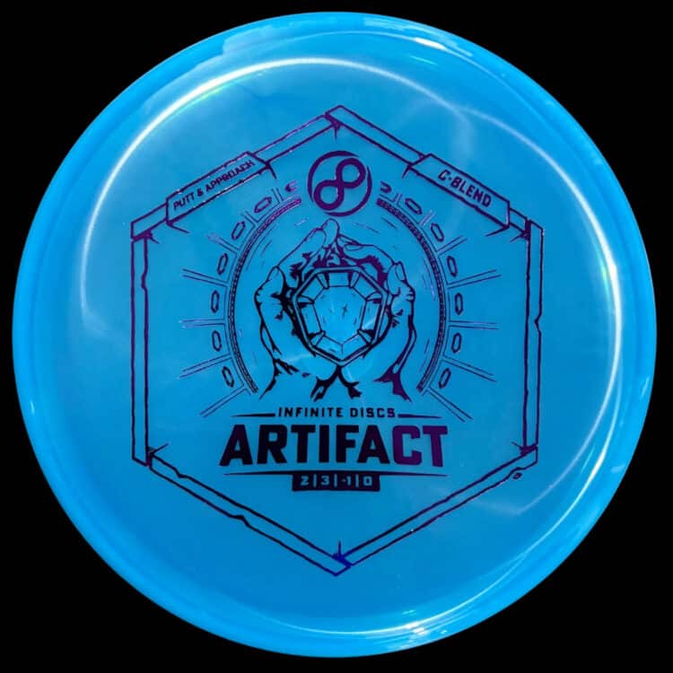 A blue C-Blend Infinite Discs Artifact disc golf disc