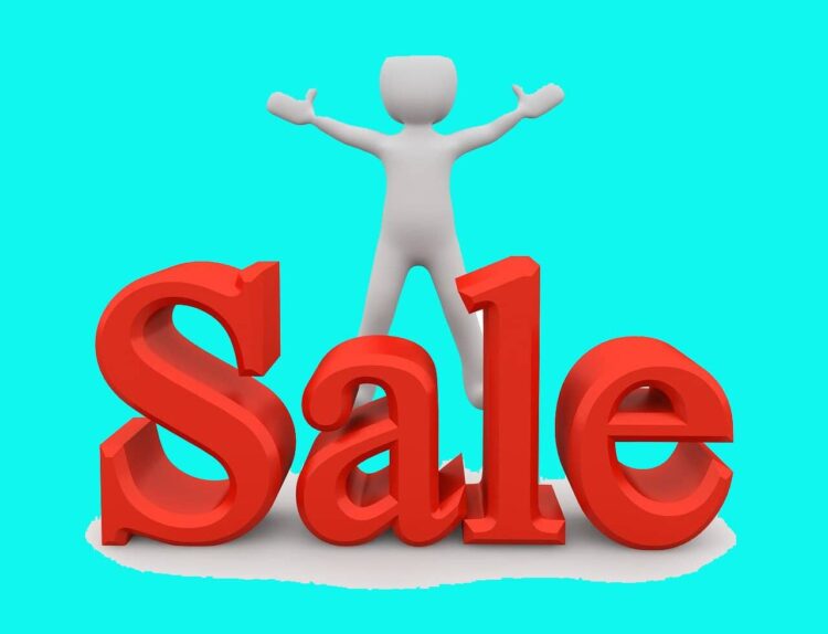 The word 'Sale' in front of a cartoon person