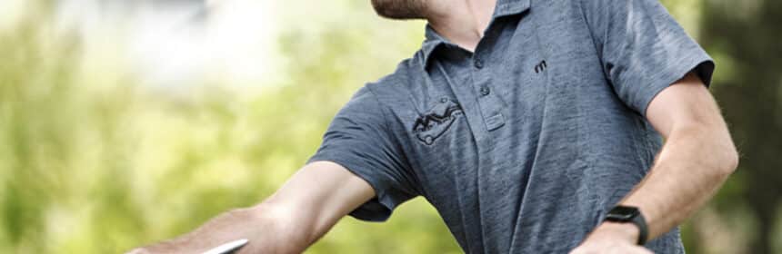 Someone throwing a hyzer flip disc golf shot