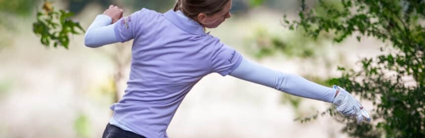 Professional disc golfer throwing a disc