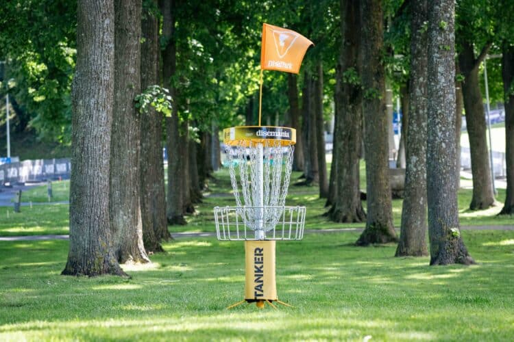 A disc golf tunnel shot lined with trees